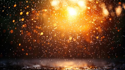 Naklejka premium Golden light bokeh and water droplets on a dark background.
