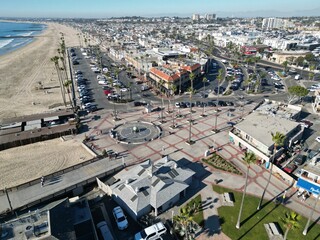 Newport Beach, California, November 20. 2024: New poer Beach, California, In Fall looking at kids at the piwe tht replaced the Mcfadden Wharf and the Pier Plaza from a UAV Drone