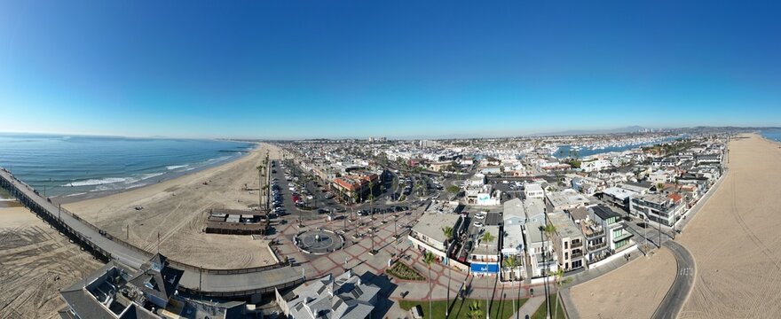 Newport Beach, California, November 20. 2024: New poer Beach, California, In Fall looking at kids at the piwe tht replaced the Mcfadden Wharf and the Pier Plaza from a UAV Drone