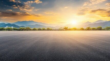 Fototapeta premium Serene Mountain Landscape at Sunset with Open Road and Vibrant Sky