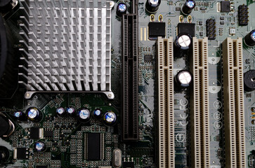 Electronic printed circuit board with SMD components, with chips, and cooling radiators