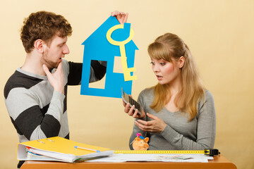 Young couple worried about money for house.