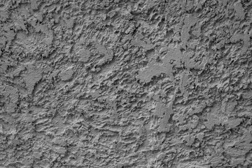 Close-up of rough textured concrete surface in grayscale. A perfect abstract background for industrial, architectural, or design projects. Ideal for textures and patterns.