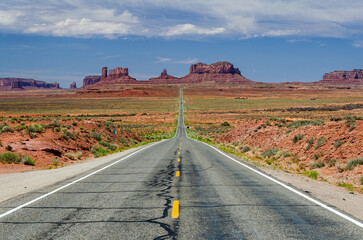 Road through the desert leading towards Monument Valley in the USA