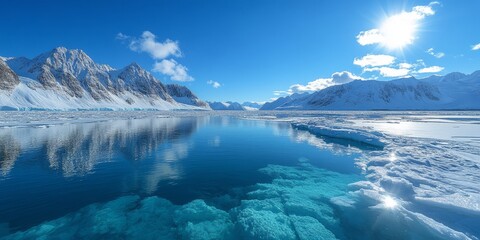 Serene and stunning view of a frozen wilderness, showcasing vibrant blue waters mirroring jagged peaks and a radiant sun in a crisp atmosphere