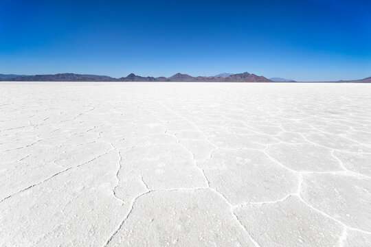 Bonneville Salt Flats in Utah. The Bonneville Salt Flats are a densely packed salt pan in Tooele County in northwestern Utah, a remnant of the Pleistocene Lake Bonneville,