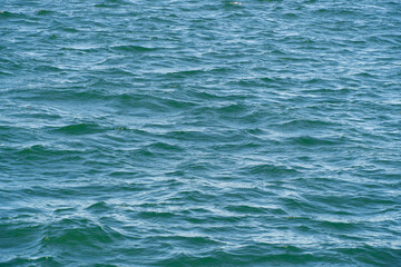 Obraz premium Blue water background. Waves on water surface, watery texture