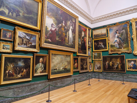 London, UK - November 20, 2024: Room full of oil paintings hanging on the walls inside the Tate Britain art gallery