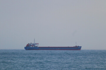 Large cargo ship sailing on the sea