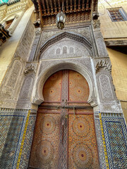 Wooden doors agains white-washed homes in Morocco