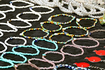 Vintage beaded jewelry at a flea market
