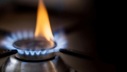 Gas burner flame igniting, symbolizing energy, combustion, and heating.