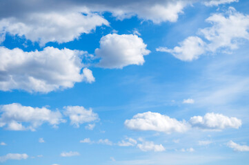 Obraz premium Sky landscape, white stunning cumulus clouds high in the vast blue sky