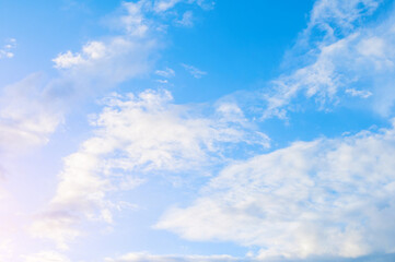 Obraz premium Sunset sky background, scenic cumulus white clouds in the picturesque sunset sky, sunset sky landscape