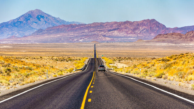 Route US 93 Alt in Nevada near Wendover. Pilot Peak and Leppy Peak provides a scenic backdrop in this remote environment.