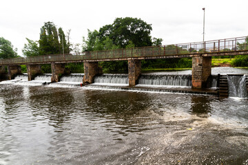 Water flowing over a weir bridge