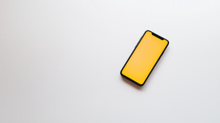 Flat lay of a smartphone with a glowing screen placed on a clean white surface, emphasizing sharp and futuristic design with a modern, minimalistic aesthetic.