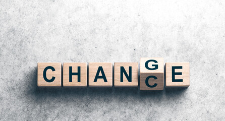 Wooden Cubes With The Word "Change" to "Chance" On Concrete Background - Personal Development And Career Growth Concept
