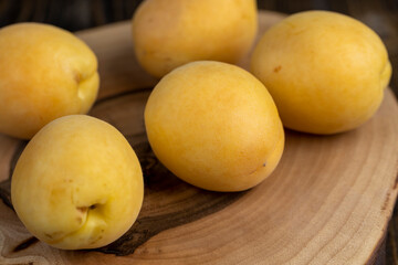 ripe soft apricot fruits on the cutting board