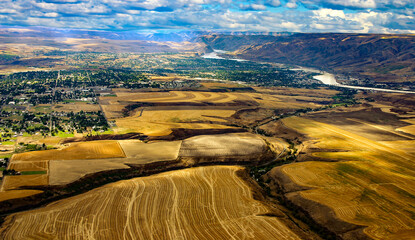aerial drone photo of the Lewis Clark Valley taken from the farming area towards the cities of Lewiston and Clarkston to include the Snake River in the background
