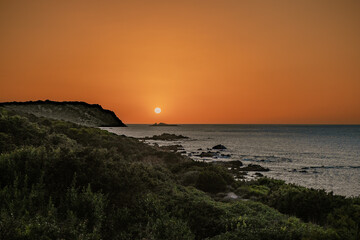 Sunset on mediterranean sea of Gallura coast in northern Sardinia island, Italy