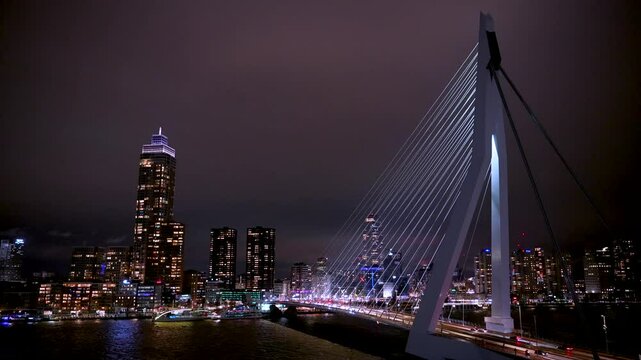 Erasmus bridge and cityscape at night, Rotterdam, Netherlands. Highest skyscraper is De Zalmhaven.