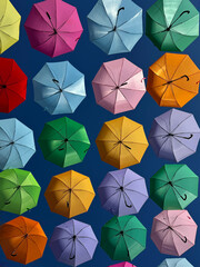 colorful umbrellas against blue sky
