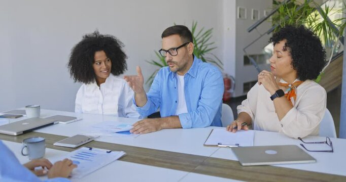 Diverse Business Team Celebrates Successful Agreement in Modern Office