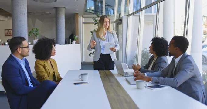 Business People Shaking Hands After a Successful Meeting in the Office