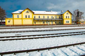 snowy small railway stations in central europe