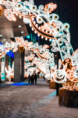 Vertical pic of defocused blurred night city lights bokeh in winter city