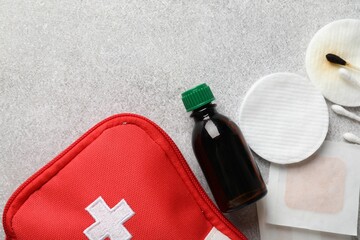 Topical iodine and other first aid kit components on light background, flat lay. Space for text