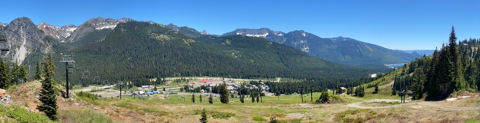Snoqualmie Pass, a panoramic view with the ski slopes in the foreground and the forests and mountains in the background on a beautiful summer day_9792.
