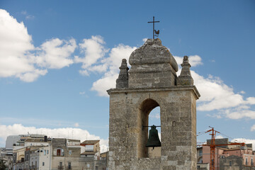 Bell tower in Gravina in Puglia on a sunny summer day, Province of Bari, Apulia, southern Italy.