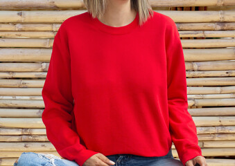 Girl wear empty red sweatshirt with copy space for your text or design. Hoodie front empty place...
