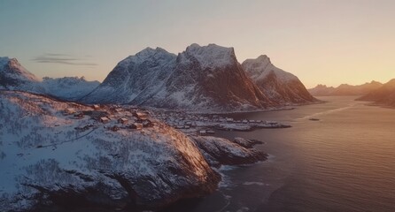 Winter aerial view of a fishing village surrounded by mountains