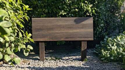 Fototapeta premium Blank wooden sign mockup in a lush garden setting, perfect for directional guidance or tourism signage, featuring natural greenery and gravel path.
