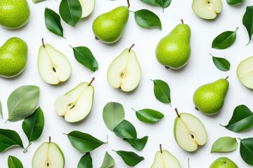 Obraz premium Halved and sliced green pear on a white background viewed from above