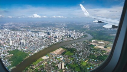 Aerial View of Cityscape and River from Airplane Window