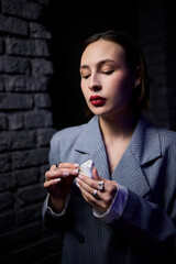 Chic Woman Enjoying Music with Wireless Earbuds in a Contemporary Setting that Inspires