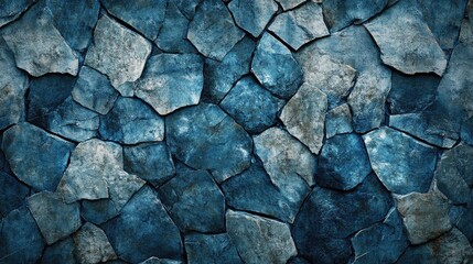 Fototapeta premium Textured background featuring an intricate pattern of blue and gray stones arranged in a visually striking mosaic design.