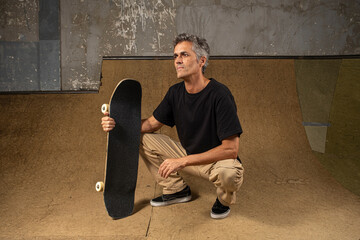 54 year old Brazilian skateboarder in a photo shoot at a skate park_13.