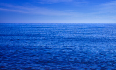 Fototapeta premium Blue ocean background, sea with evening sky, Ripple wave and calm sea with beautiful light