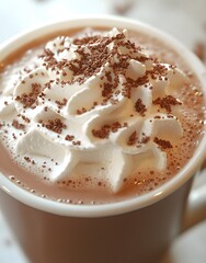 Fototapeta premium A close-up of a creamy hot chocolate topped with whipped cream and chocolate shavings.