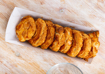 Sweet crispy cookies with almonds served for dessert