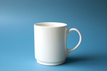 Fototapeta premium White Ceramic Mug on Blue Background