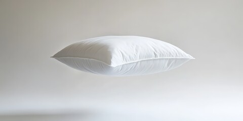 Floating White Pillow Against Light Background