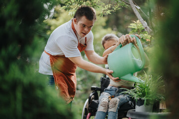 A young man assists a woman in a wheelchair while watering plants together. This image captures a...