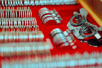 Trial frame and Lenses for Eyesight Optometry Testing. Optical instrument of diopter measurement in...