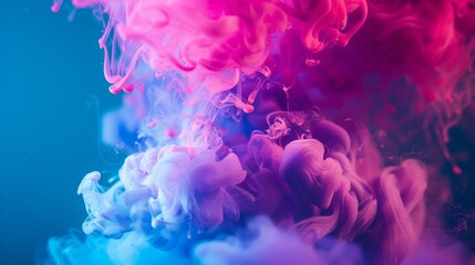 Obraz premium Vibrant pink and blue ink swirling underwater in abstract design